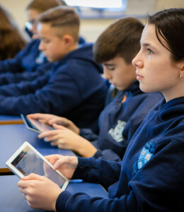 a student with a tablet in the classroom