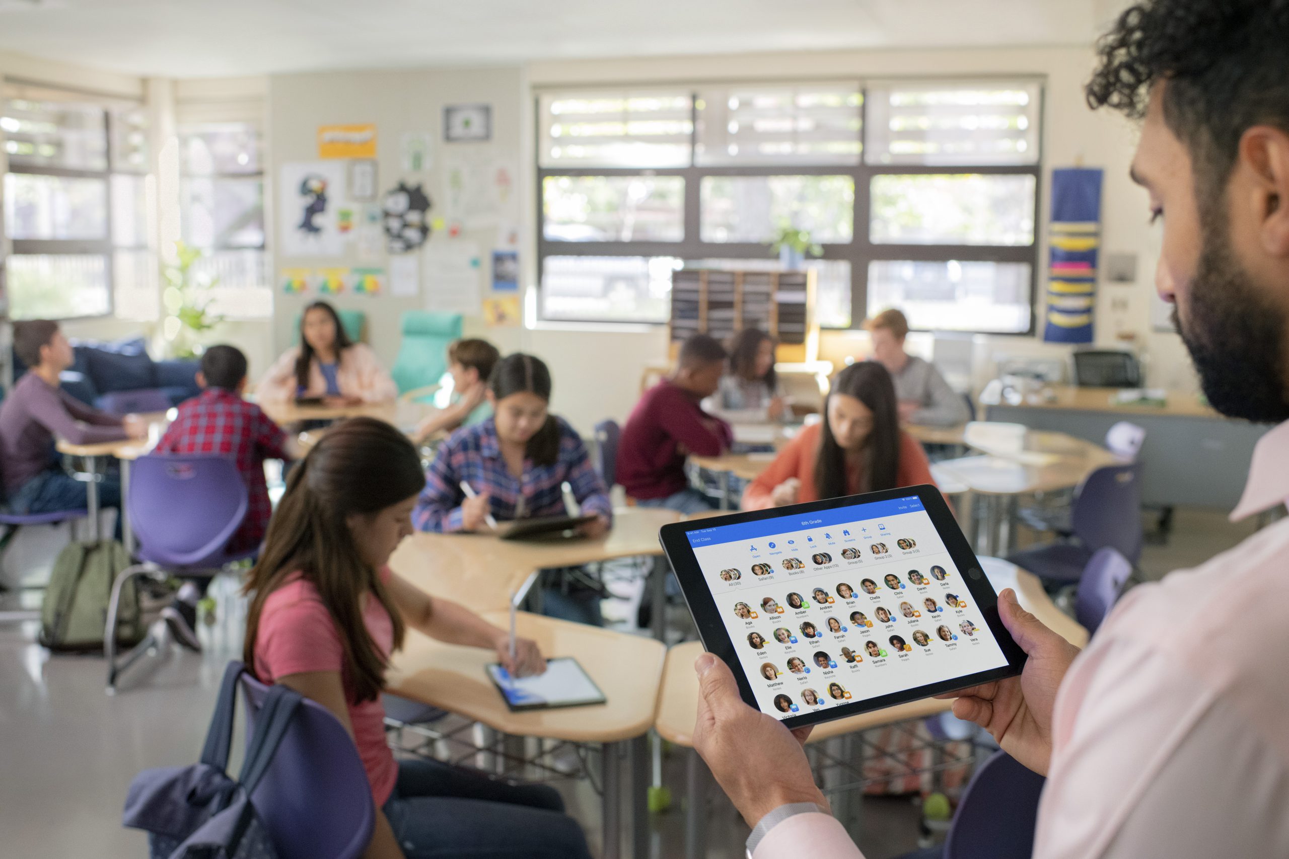 A teacher using iPad in the classroom