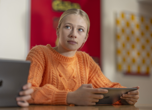 A Student Using Ipad In Class
