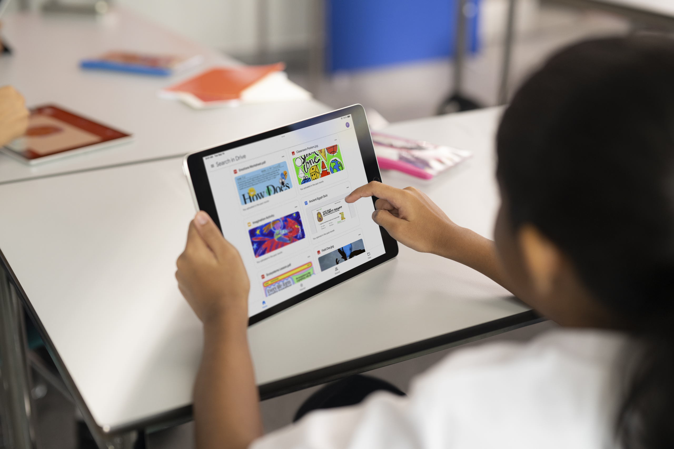 A student look at project work on their ipad