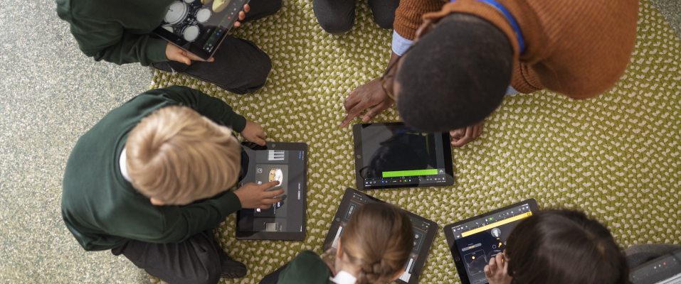 students using garageband on ipad in school