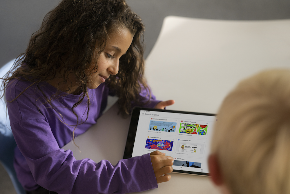 a female student looking at her ipad