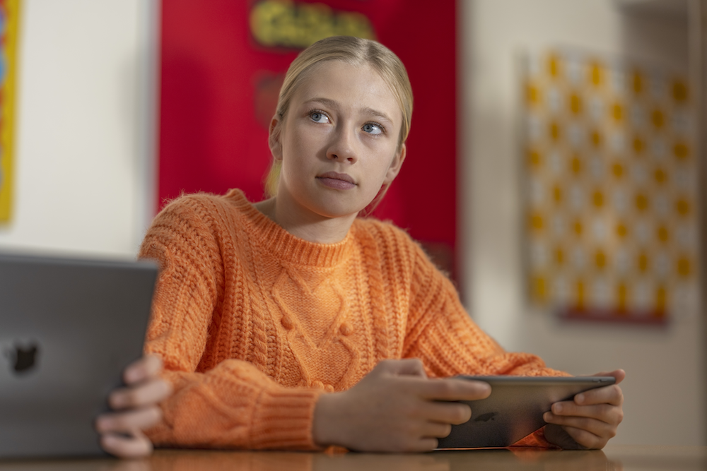 a female student looking up in class