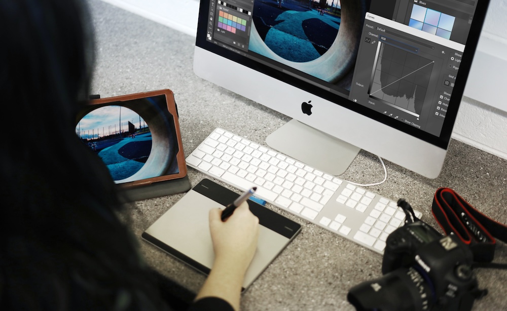 a student using a macbook in college