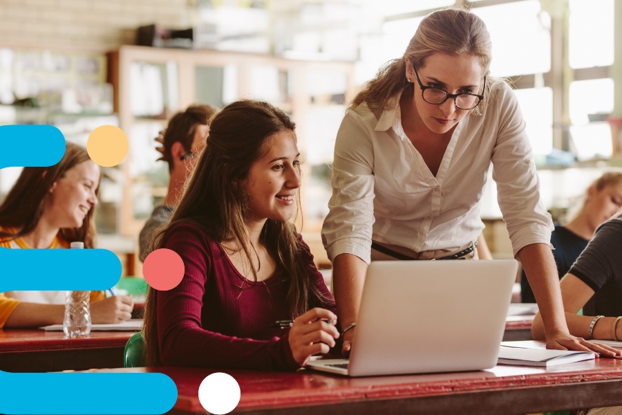 teacher with student and laptop teacher with student and laptop