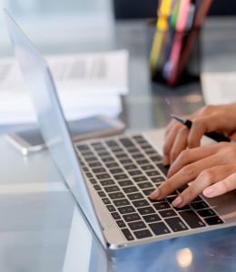 a woman using a laptop a woman using a laptop
