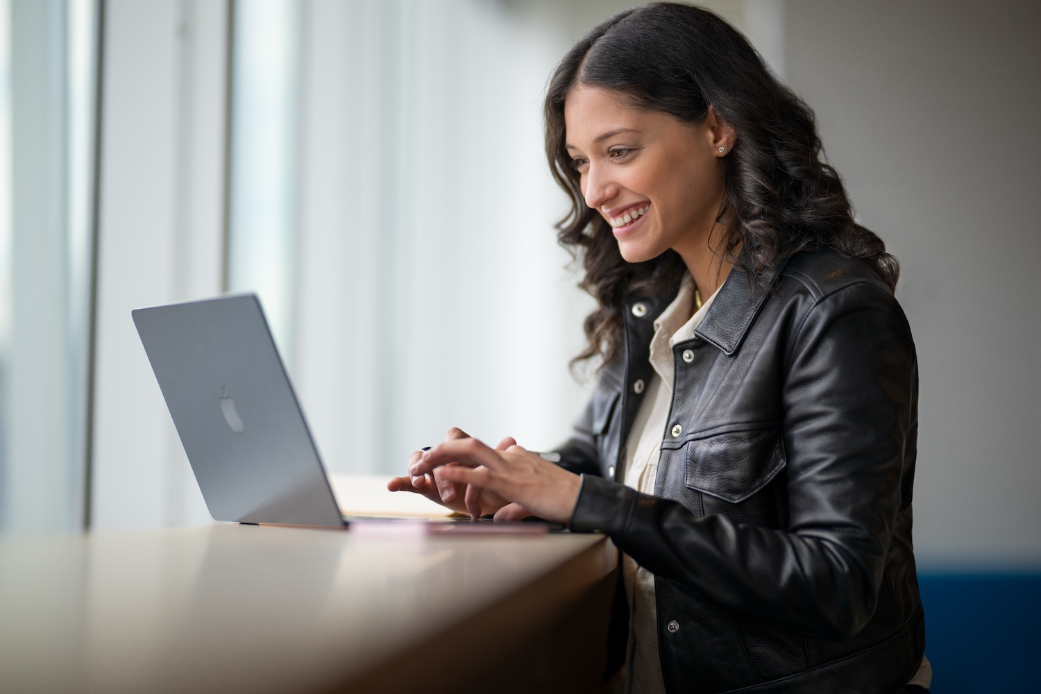 a student using a macbook at college
