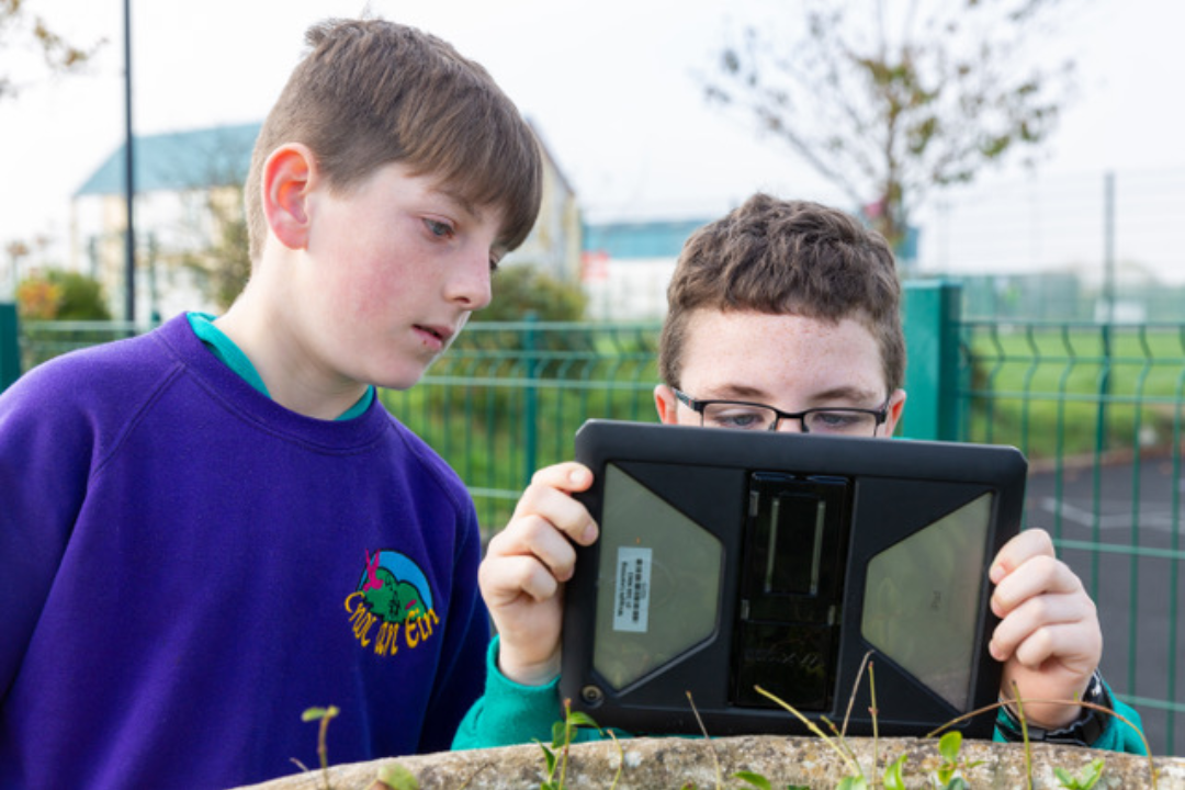 children using an ipad in school